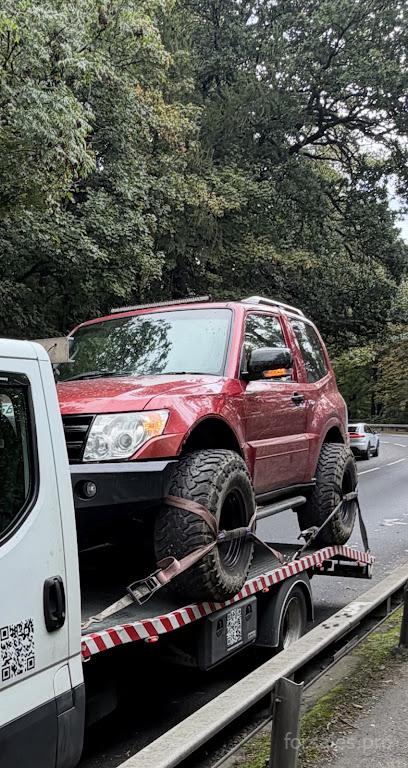 Professional vehicle breakdown recovery in Stockport towing a car safely.