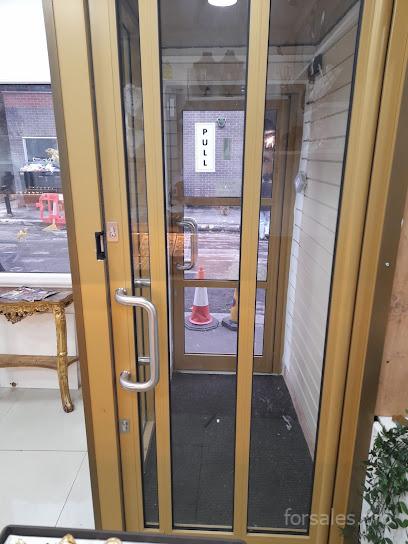 Professional installation of secure retail frontage by Shopfront Services Manchester